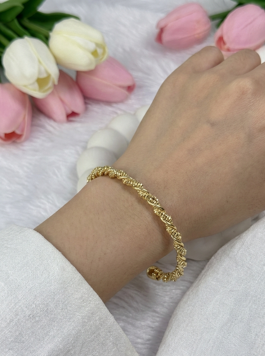 Gold-colored twisted open cuff bracelet