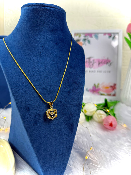 Gold-tone necklace with an ornate | Pendant