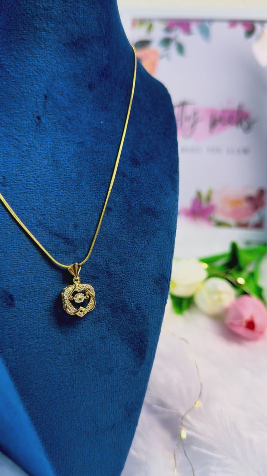 Gold-tone necklace with an ornate | Pendant